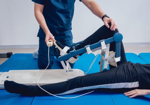 Patient on CPM machines. Continuous passive range of motion. Device to provide anatomically correct motion to both the ankle and subtalar joints. Foot's rehabilitation after injured
